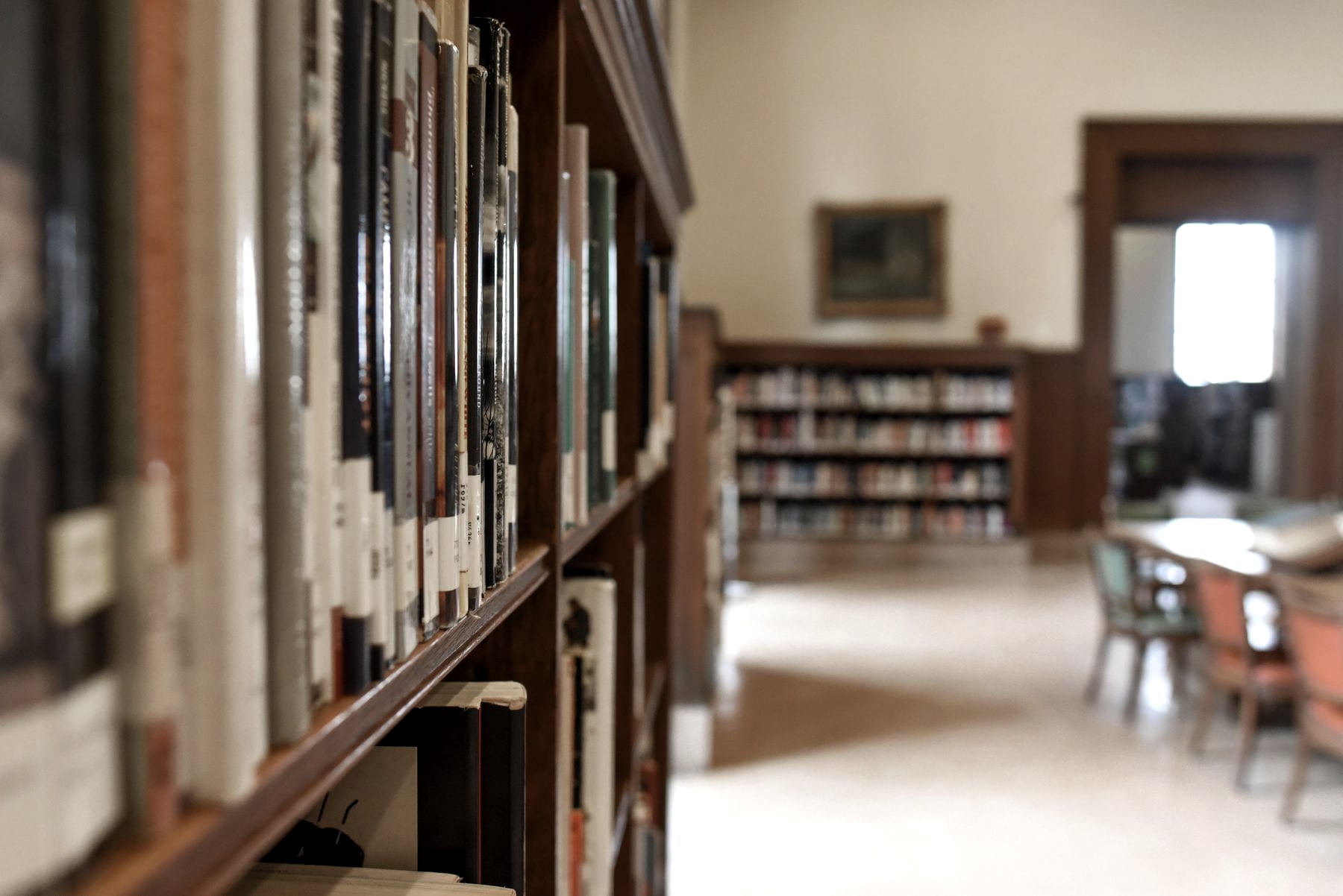 Rows of bound records on library shelves